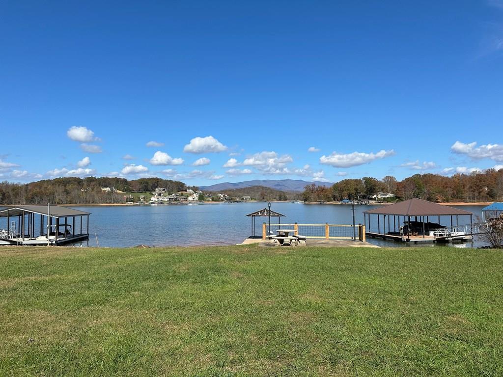 a view of a house with outdoor space and lake view