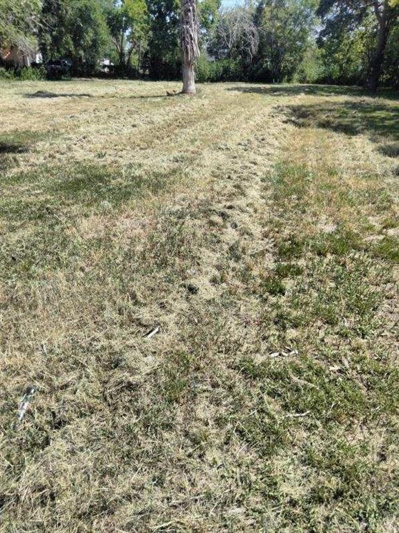 a view of a field with an outdoor space