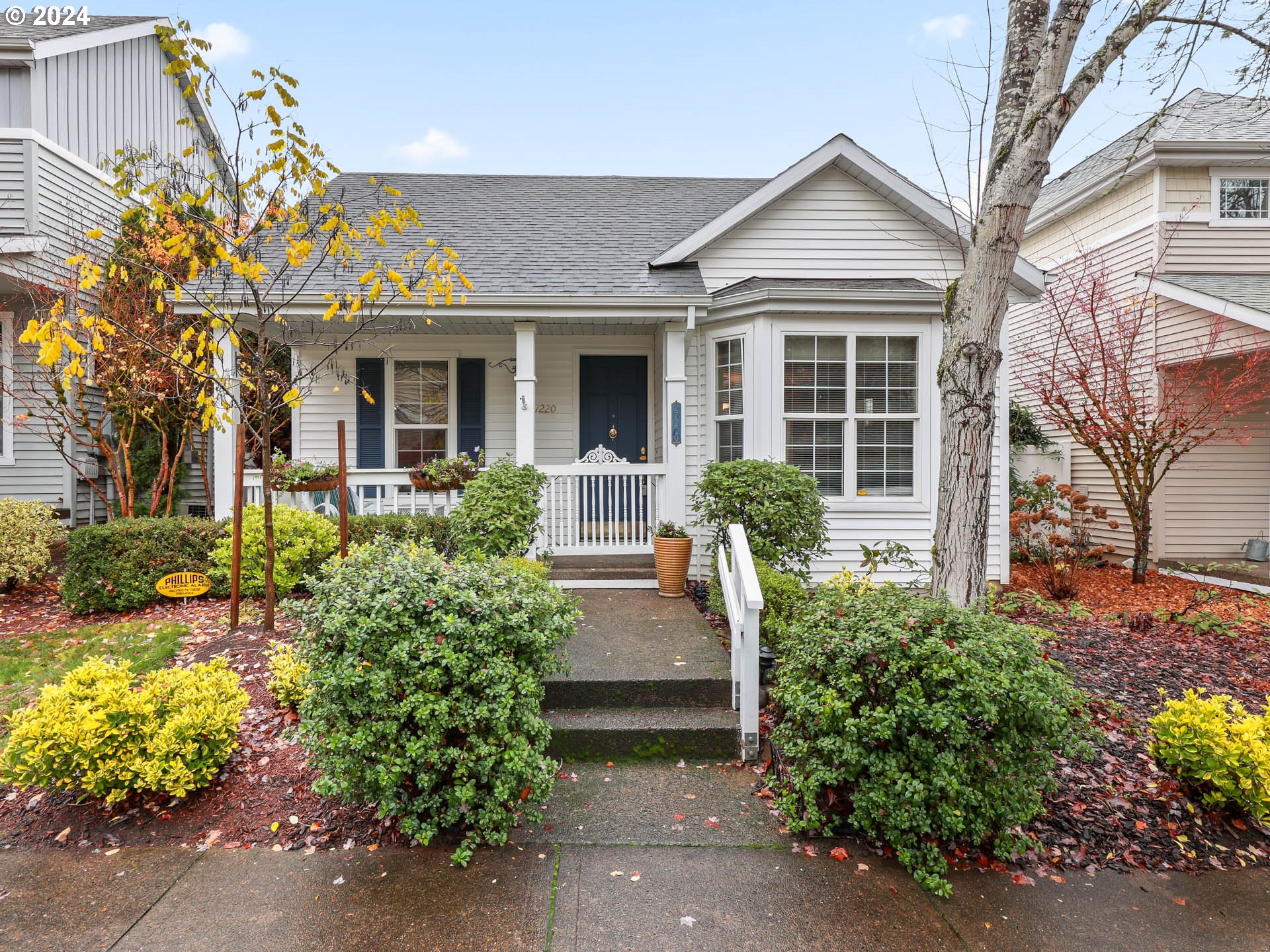 front view of a house with potted plants