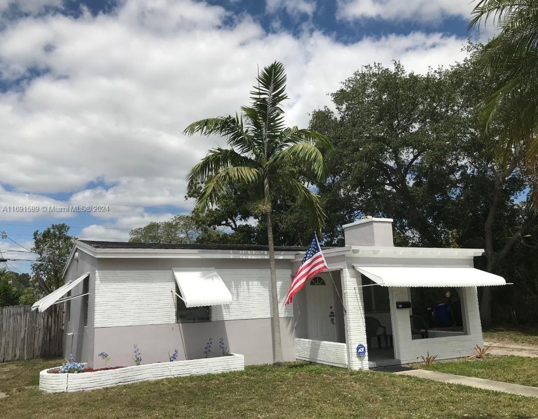 a front view of house with yard and entertaining space