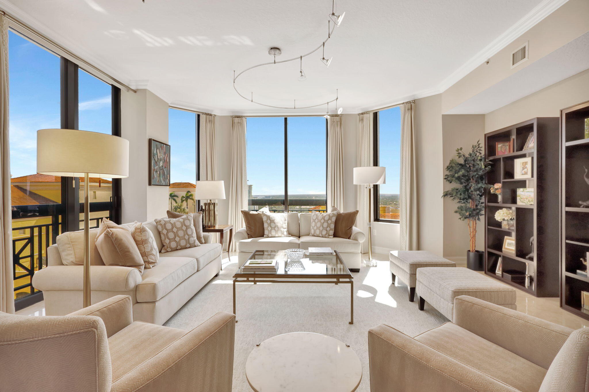 a living room with furniture and a lamp