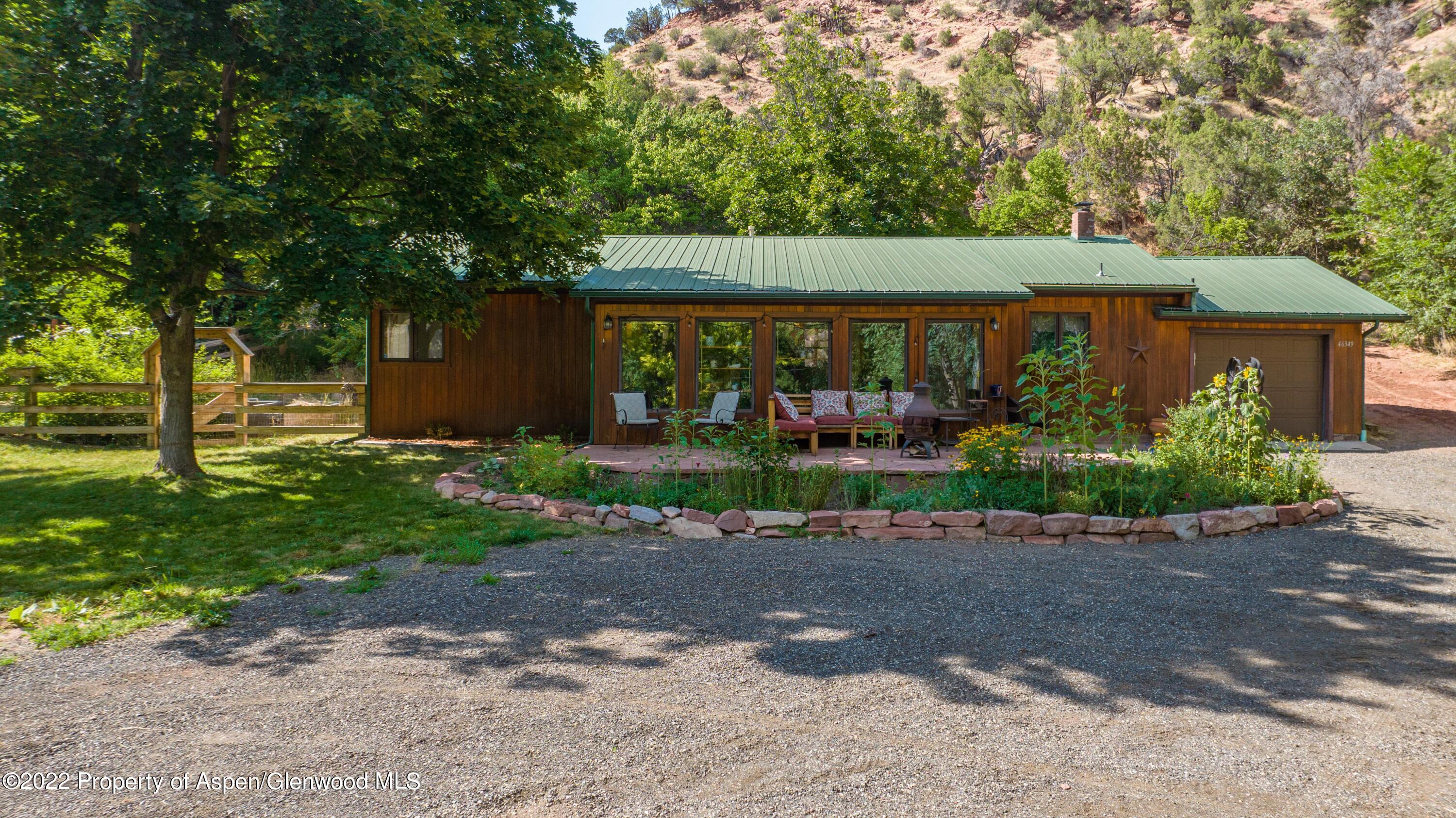 front view of a house with a garden