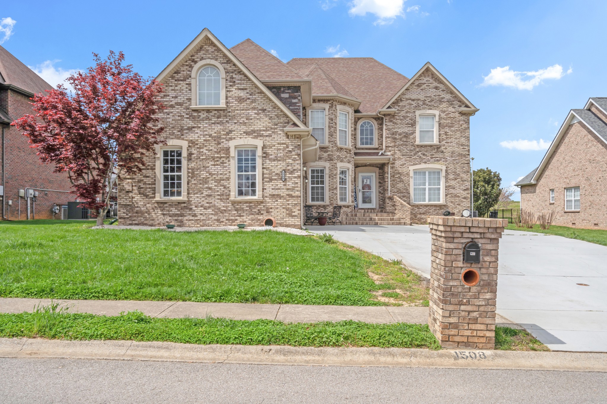 a front view of a house with a yard