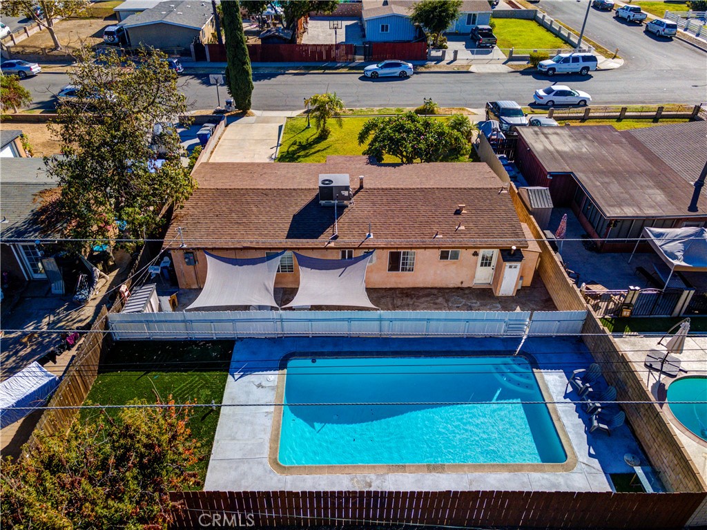 an aerial view of residential houses with yard