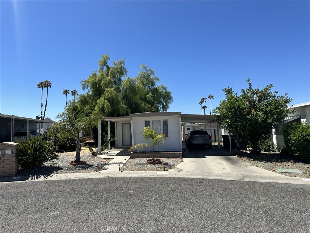 a view of a house with a yard and garage