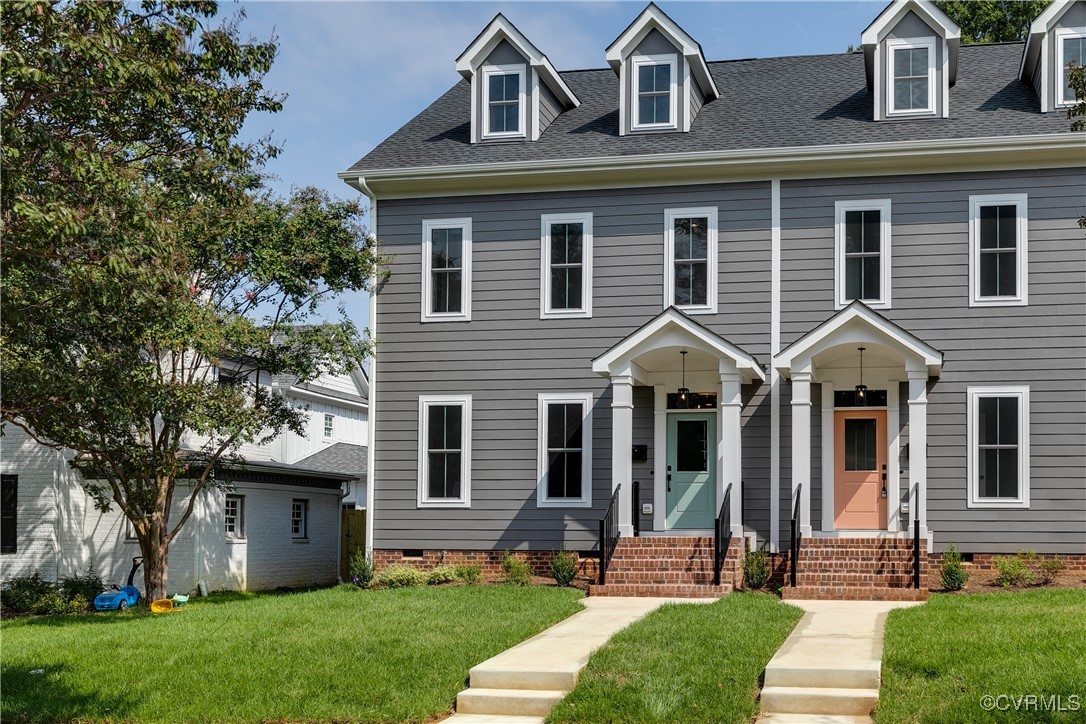 a front view of a house with a yard