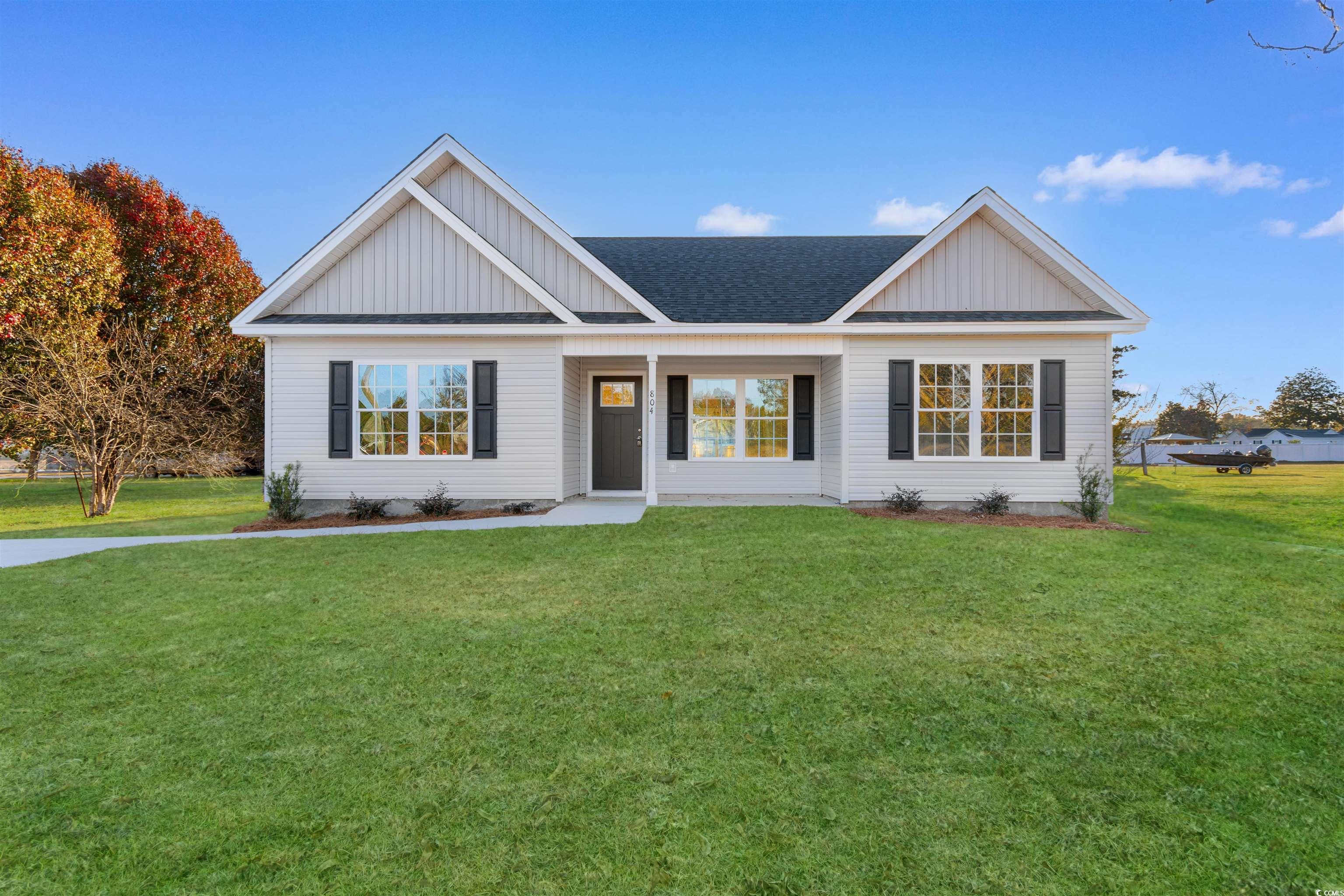 View of front of house with a front lawn