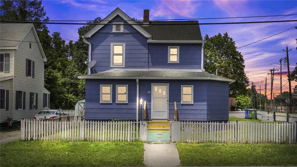 a front view of a house with a yard