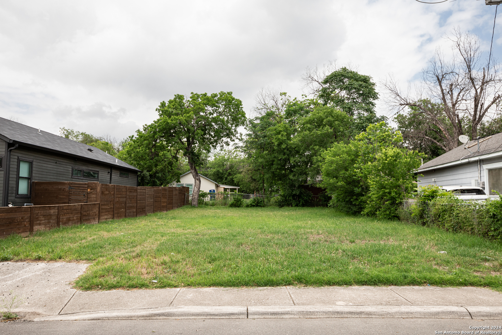 a backyard of a house with lots of green space