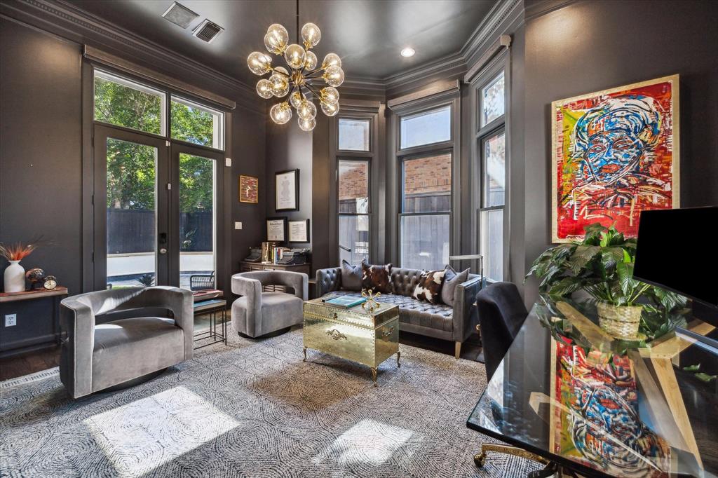 First Floor - Sophisticated Home Office. This is an elegantly appointed space with high ceilings, dark walls, and large windows providing natural light...w/ direct access to the outdoor space with covered porch.