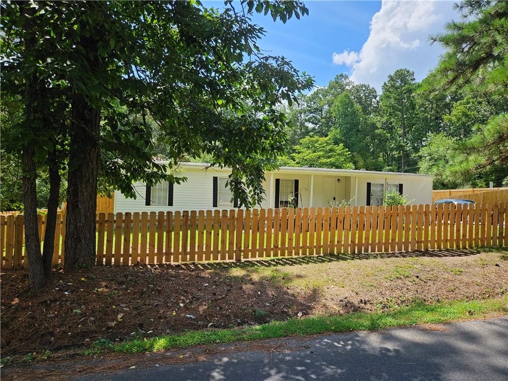 a view of a house with a fence