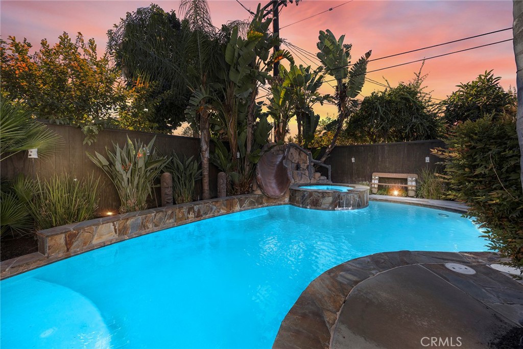 a view of a swimming pool with an outdoor space and seating area