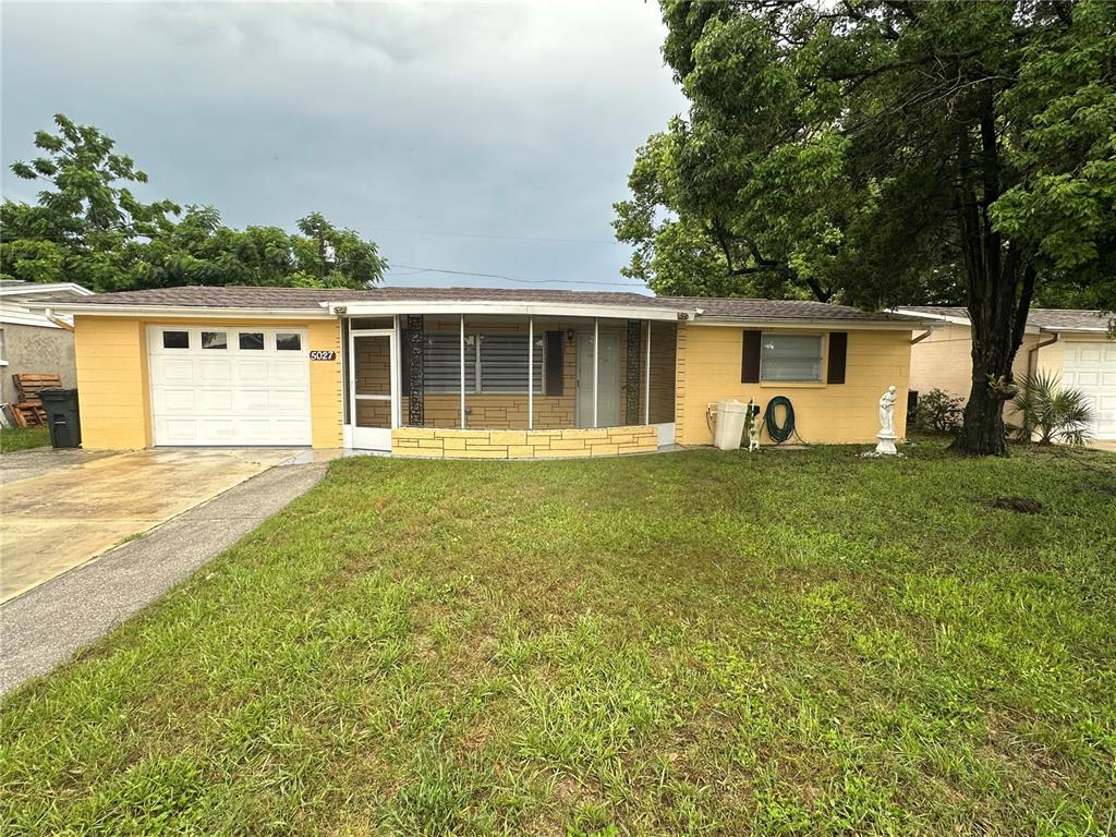 front view of a house with a yard