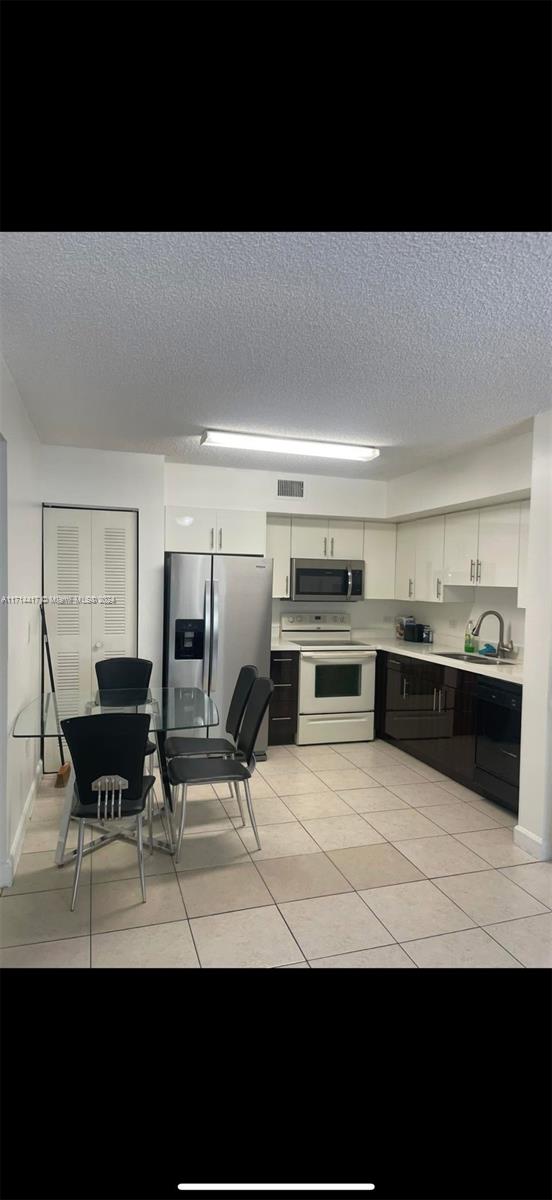 a view of kitchen area and dining room