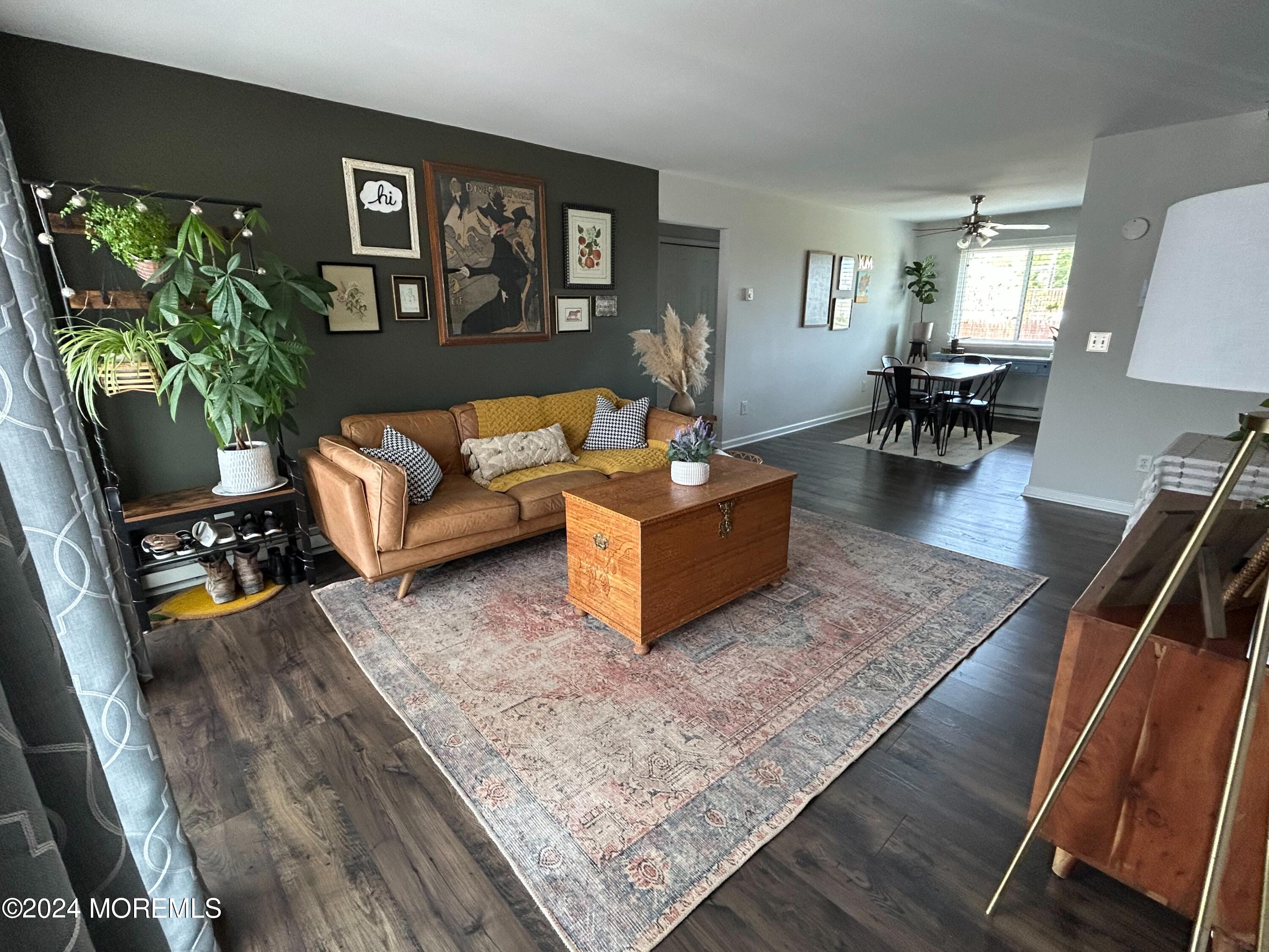 a living room with furniture rug and window