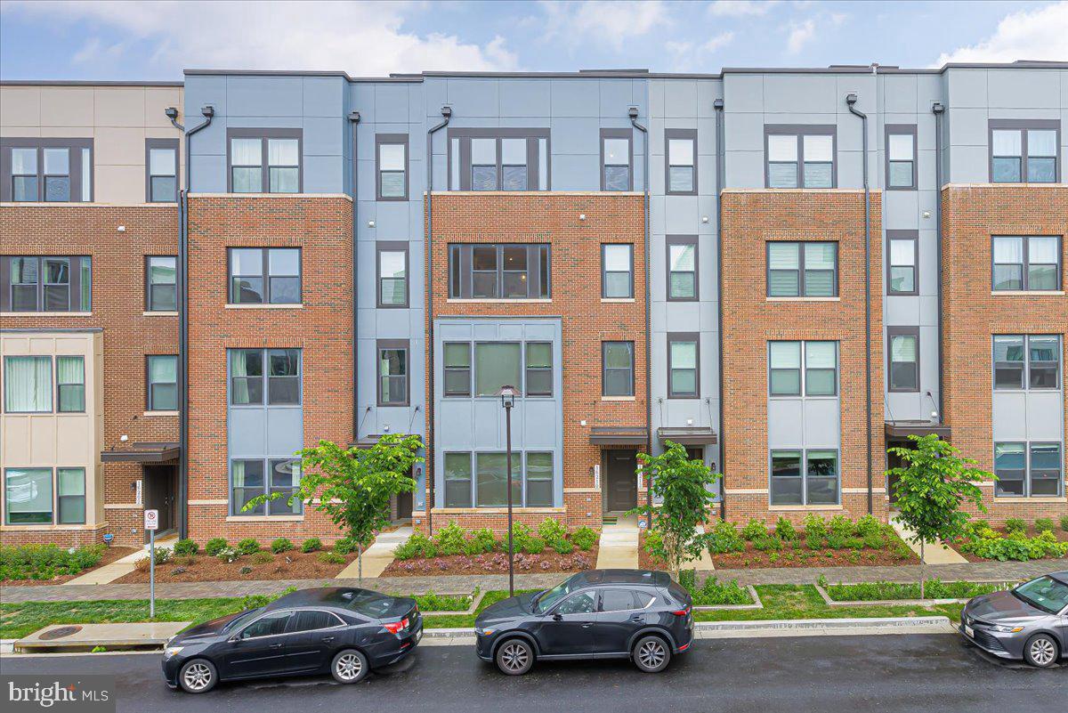 a cars parked in front of a brick building