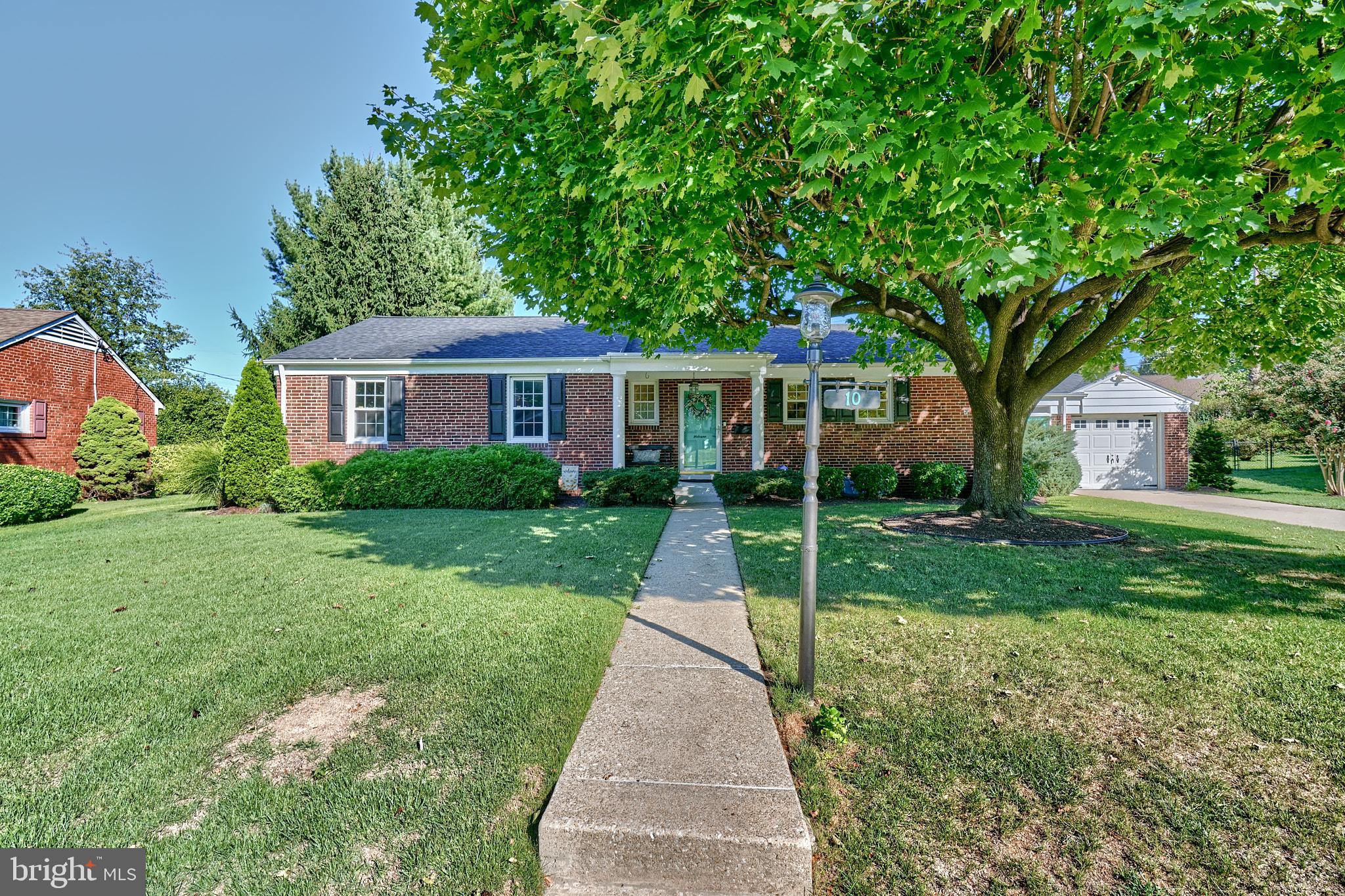 a front view of a house with yard