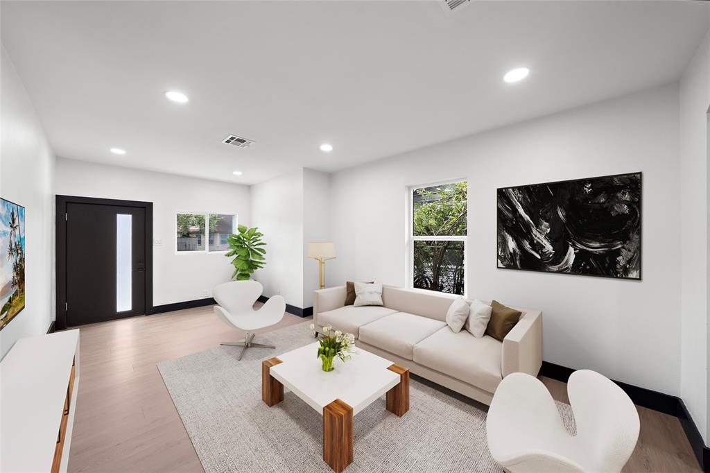 a living room with furniture and window