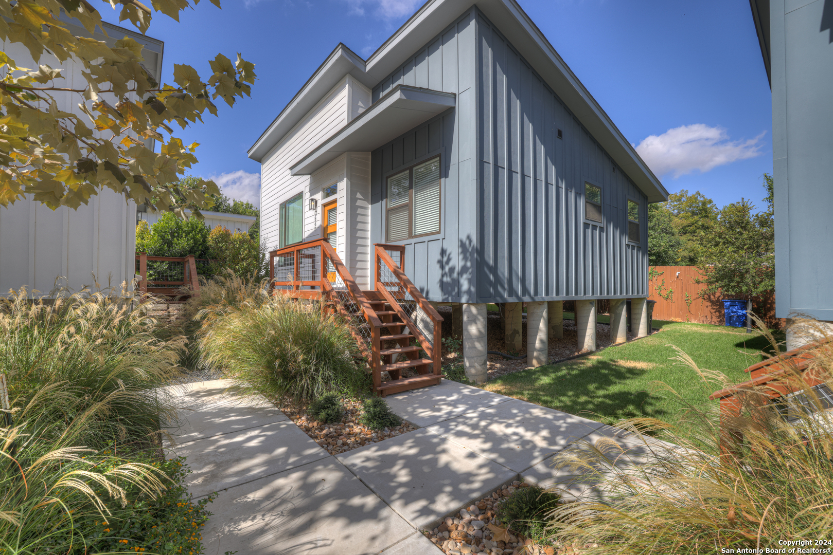 a front view of a house with garden