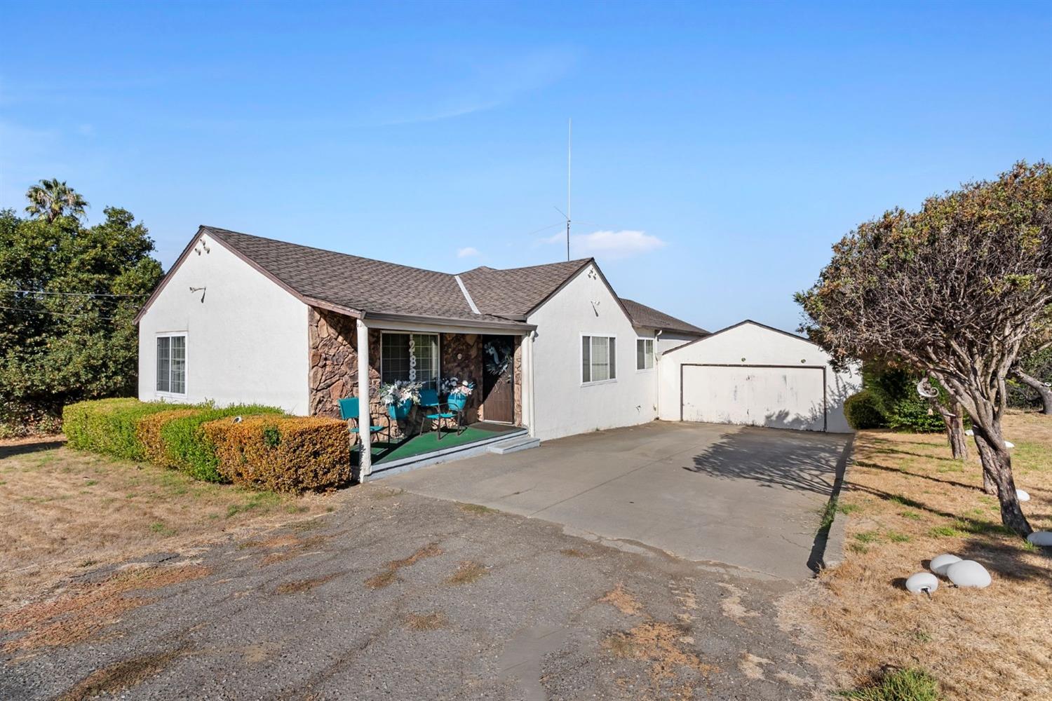 a view of house with yard and entertaining space