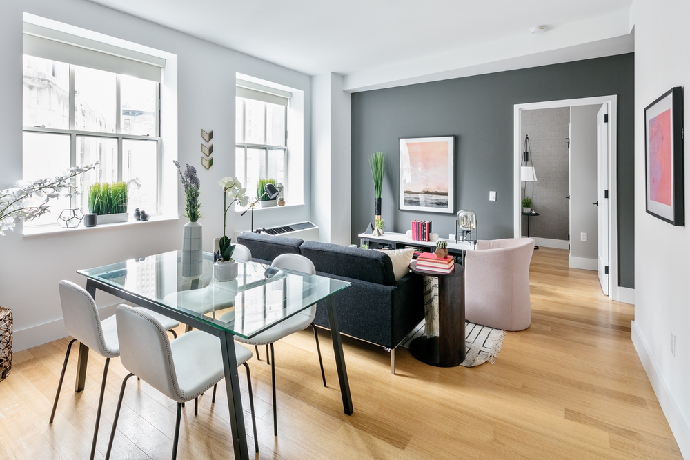 a dining room with furniture and window