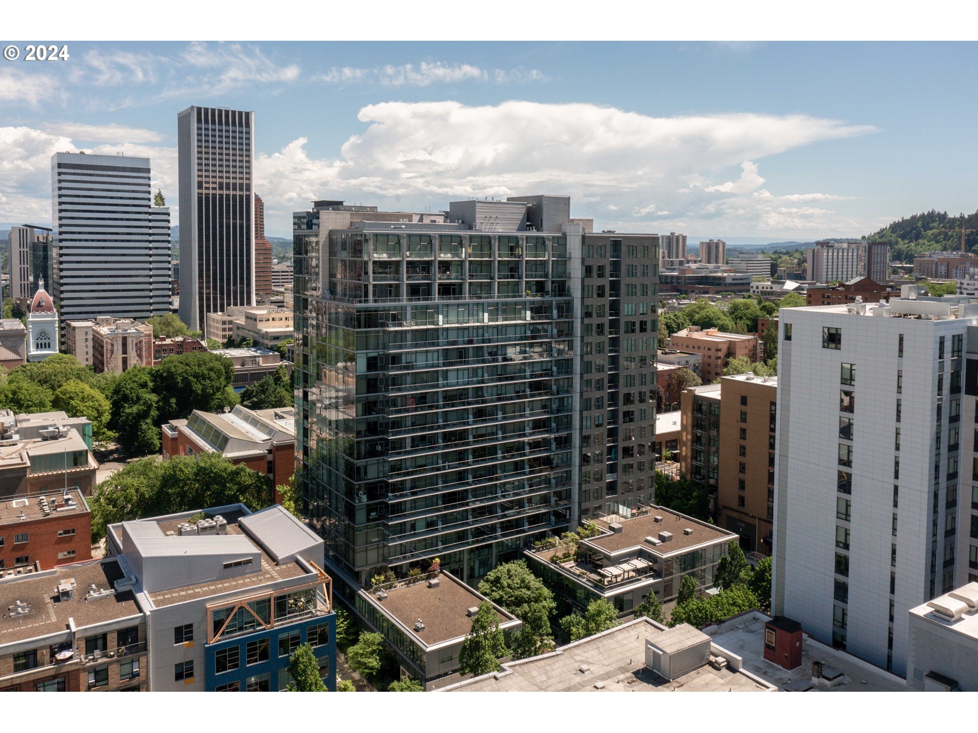 a view of a city with tall buildings