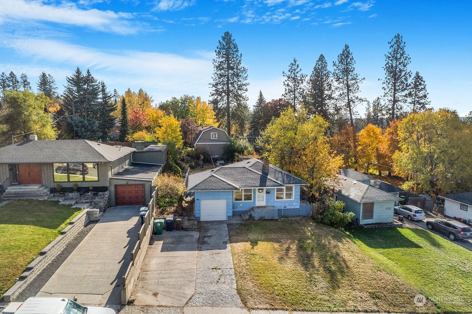 a view of a house with swimming pool next to a yard