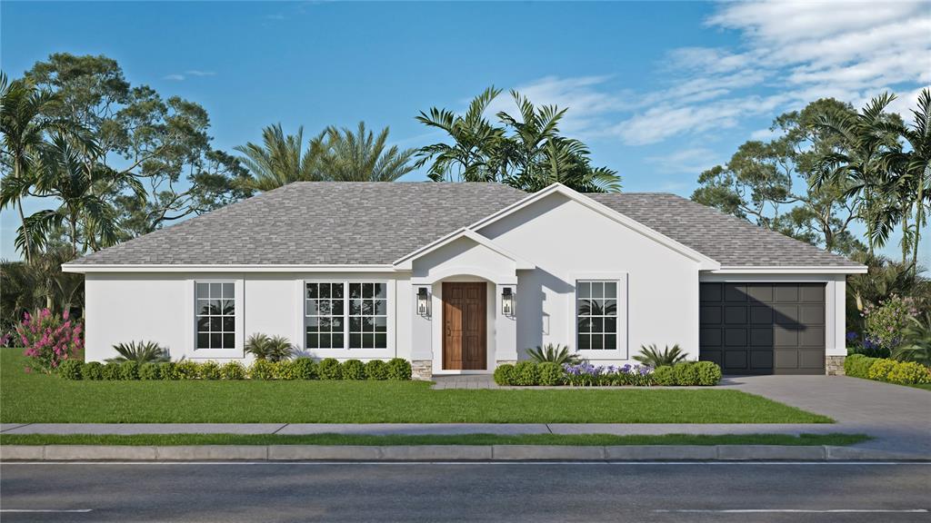 a front view of a house with a garden