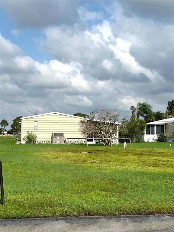 a view of a big yard with a large trees