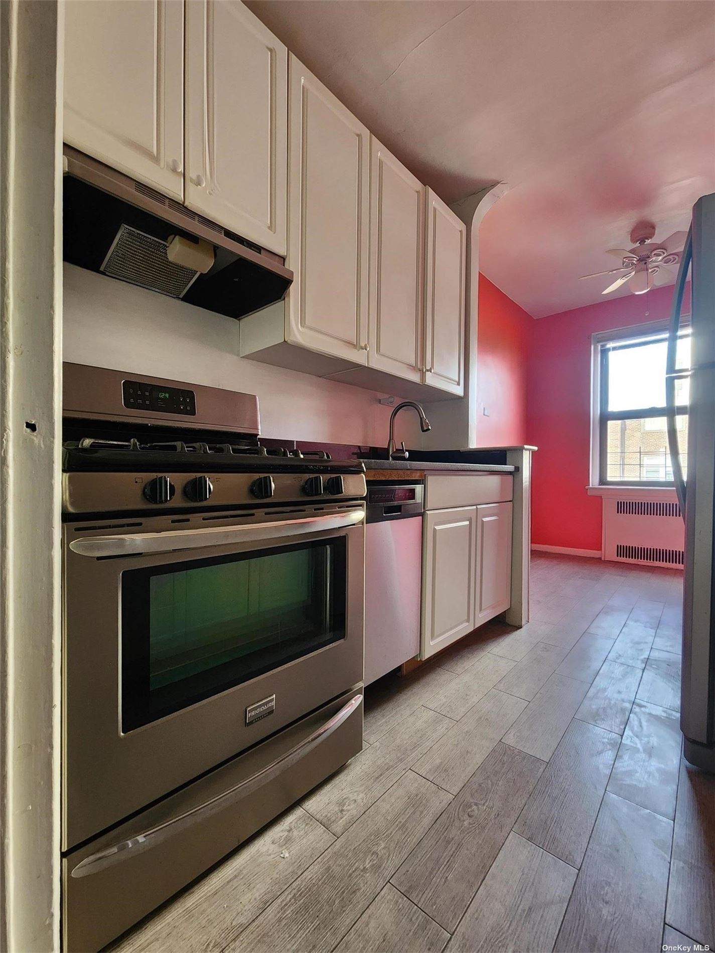 a kitchen with stainless steel appliances granite countertop a stove and a microwave