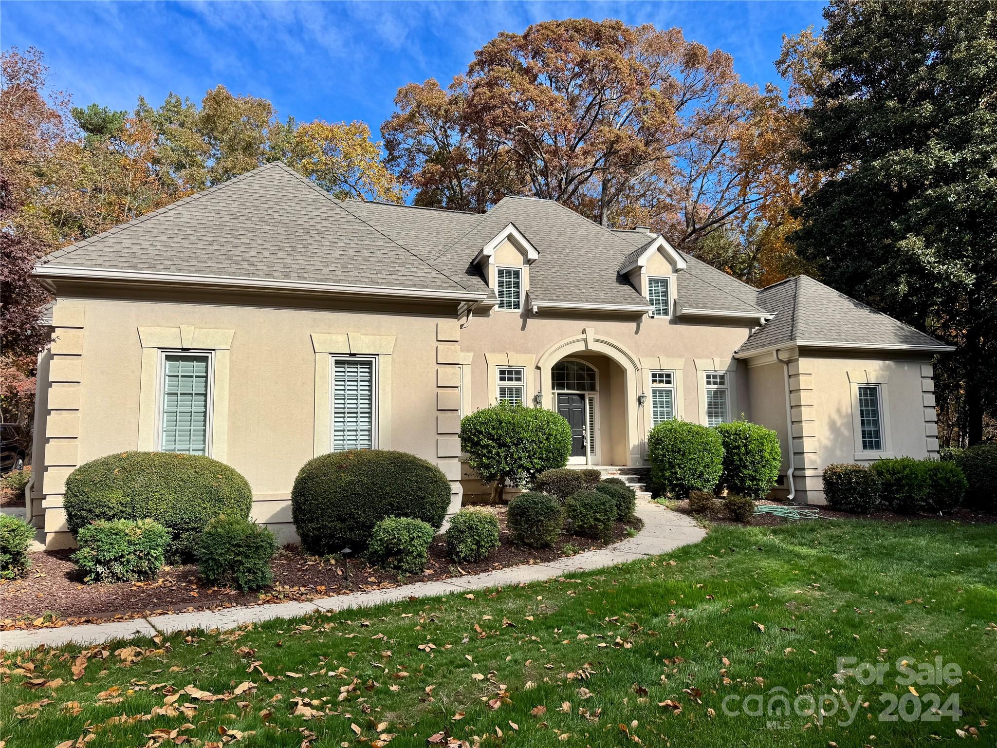 a front view of a house with a yard