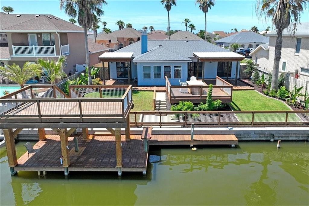 a view of house with swimming pool outdoor seating