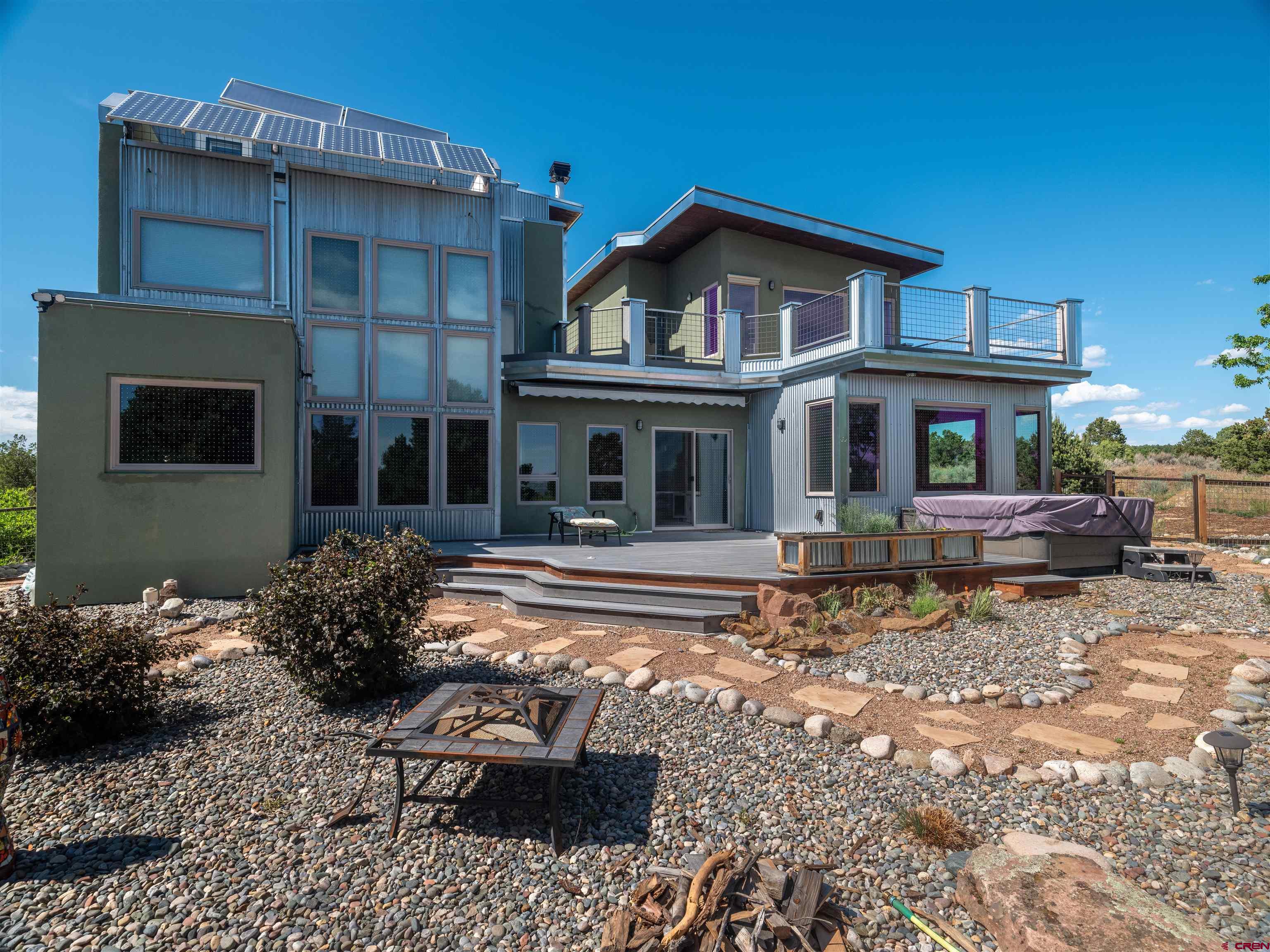 a front view of a house with sitting area