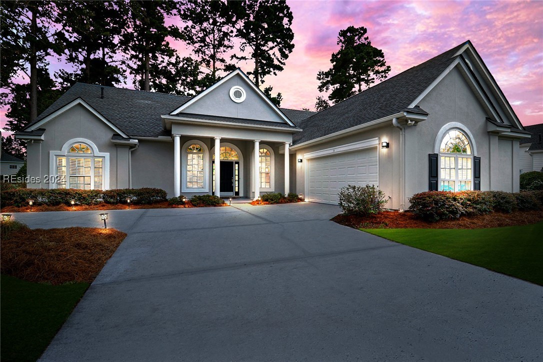 View of front facade featuring a garage