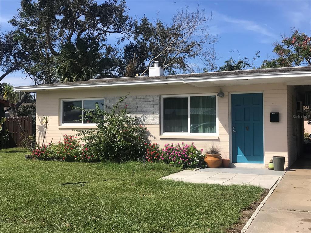 front view of a house with a yard