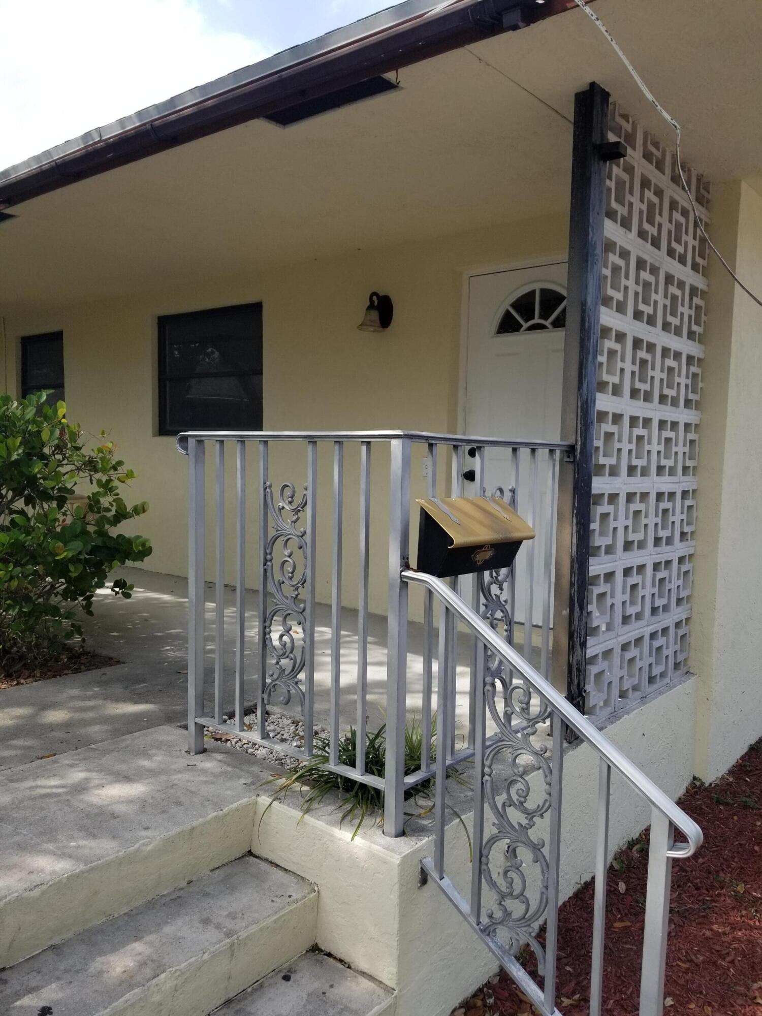 a view of a balcony with furniture