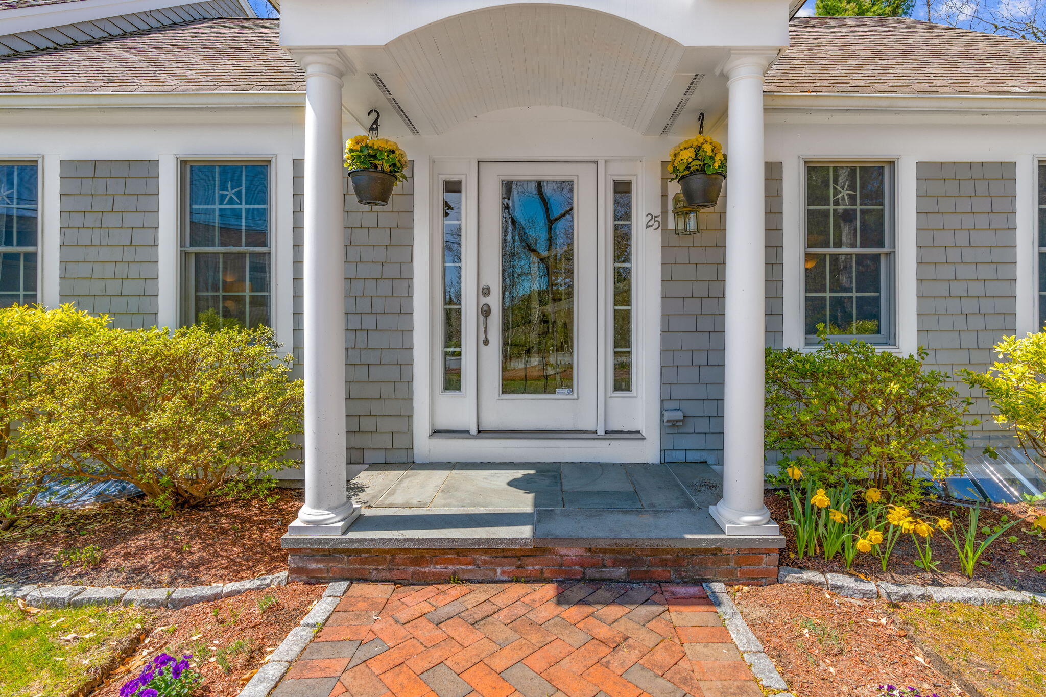 a front view of a house with a yard