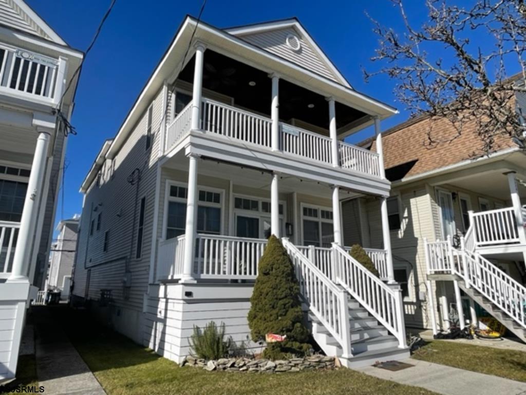 a front view of a house with stairs