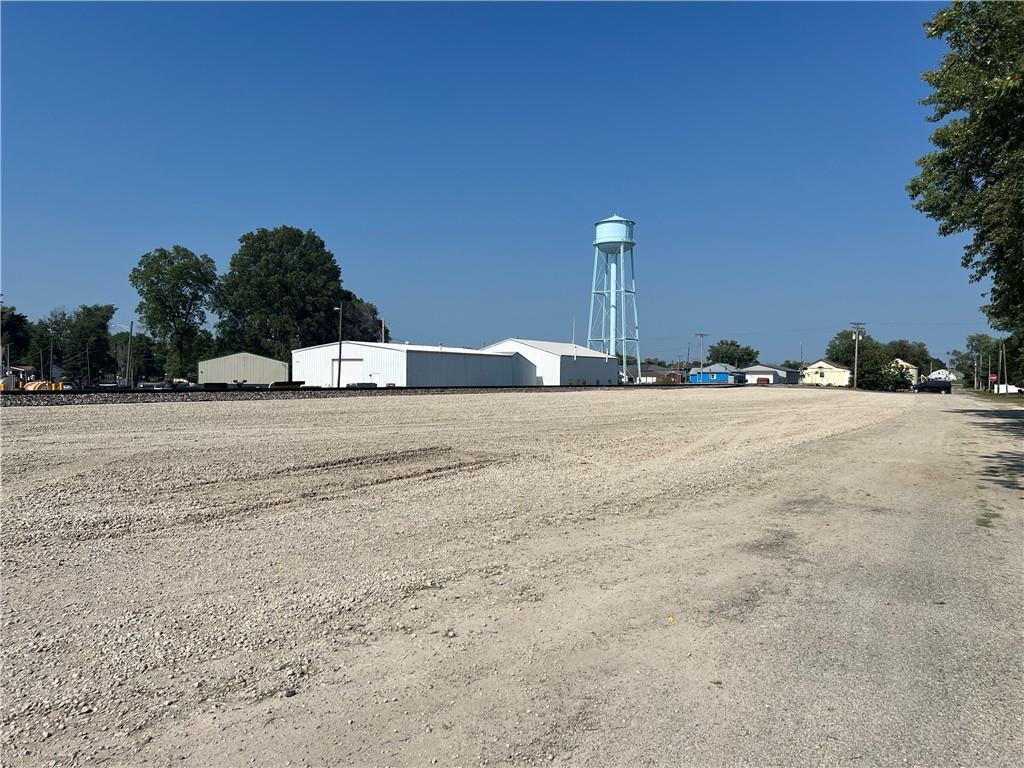 a view of a street with a building in the background