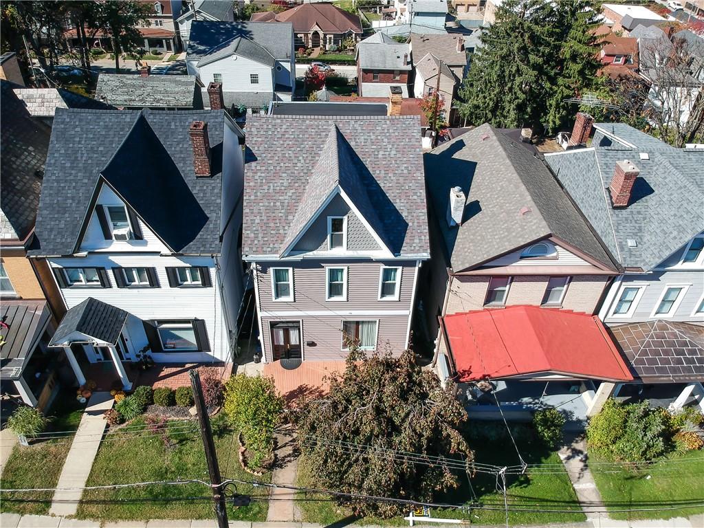 a aerial view of a house with swimming pool