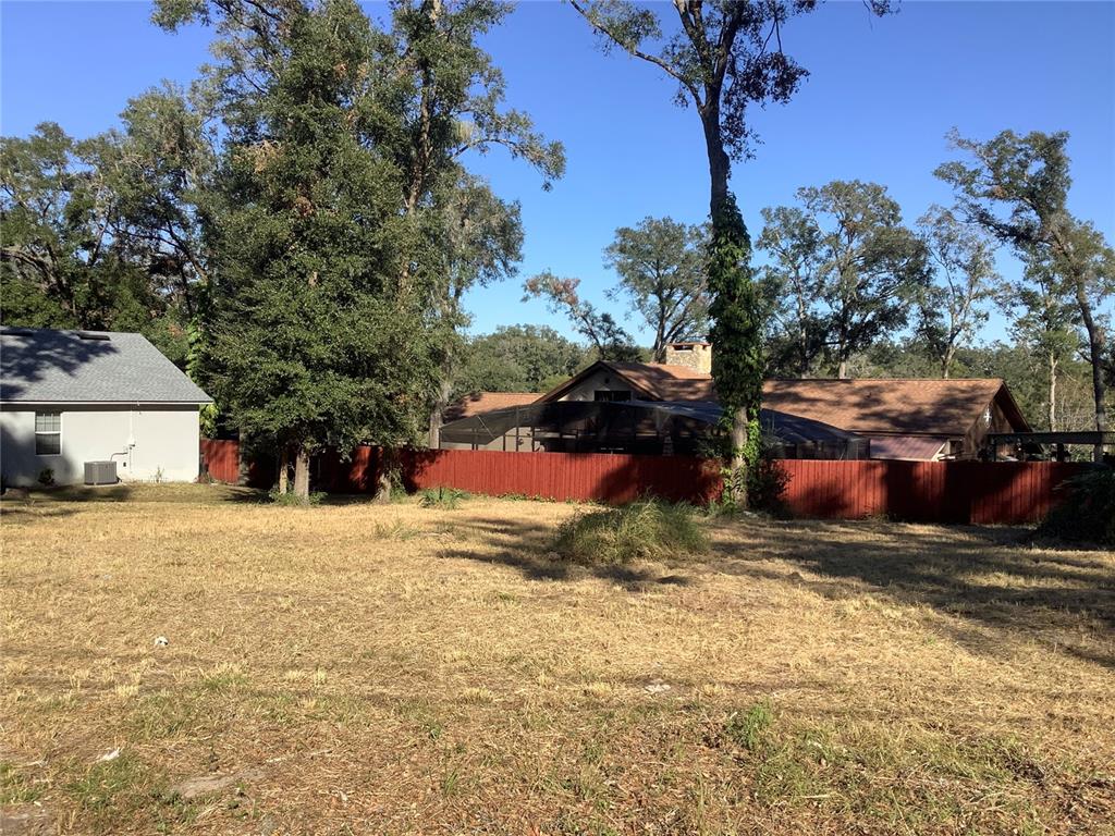 a view of the house with a yard