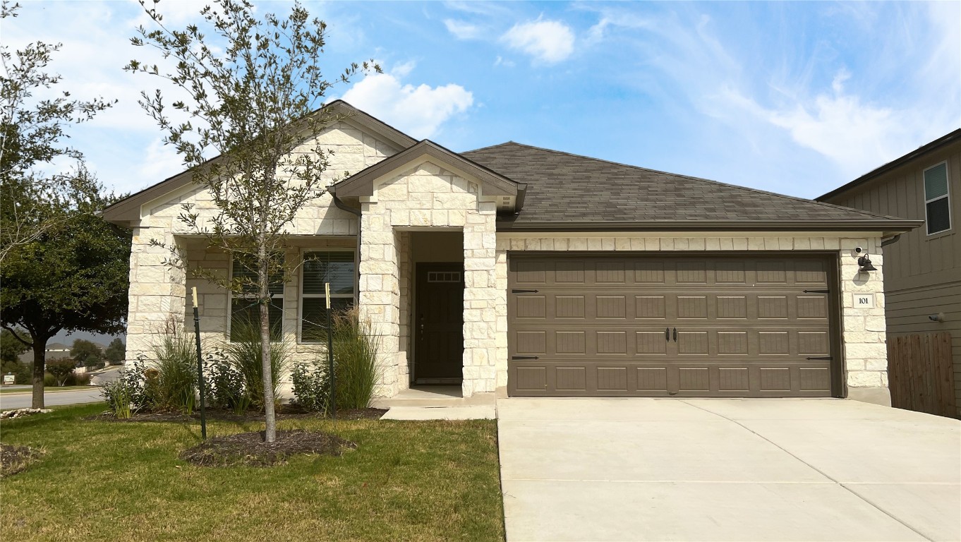 a front view of a house with a yard