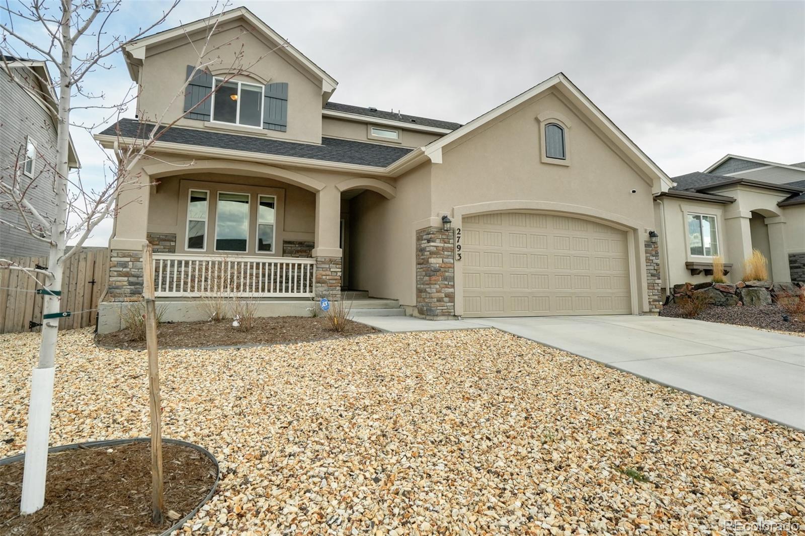 a front view of a house with a outdoor space