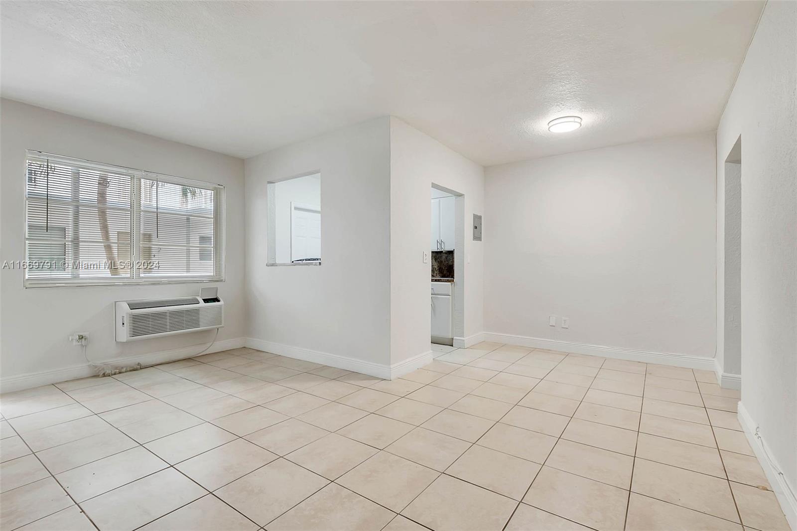 a view of an empty room and window