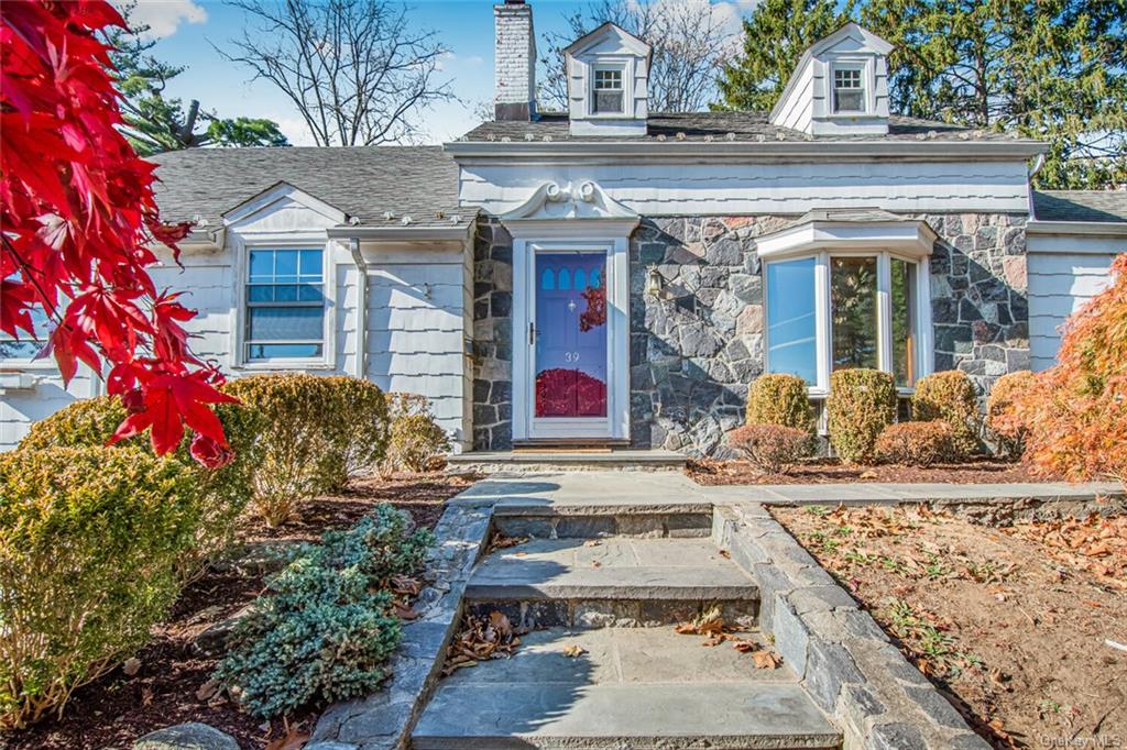 front view of house with a potted plant