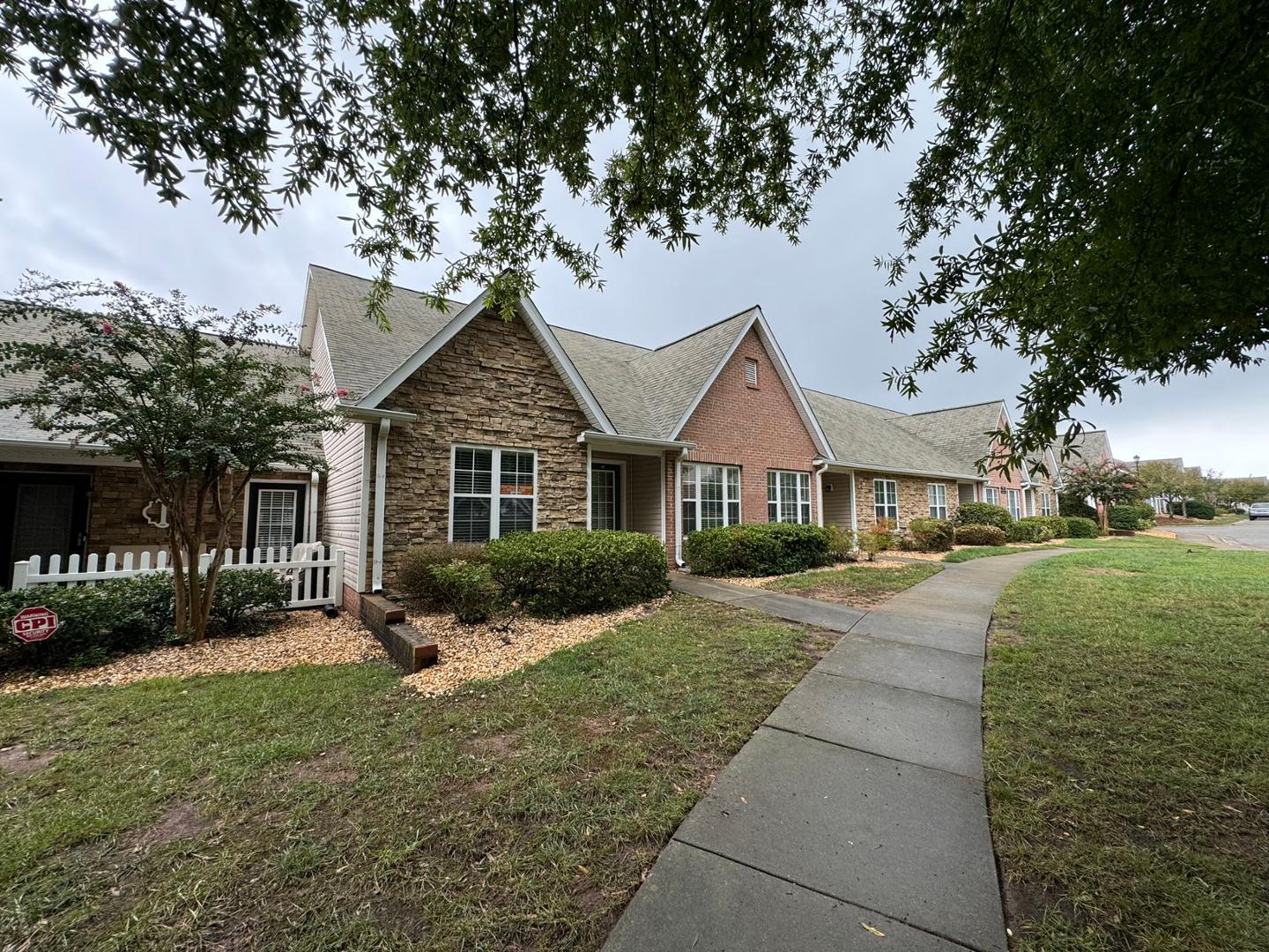 a front view of a house with a yard and porch