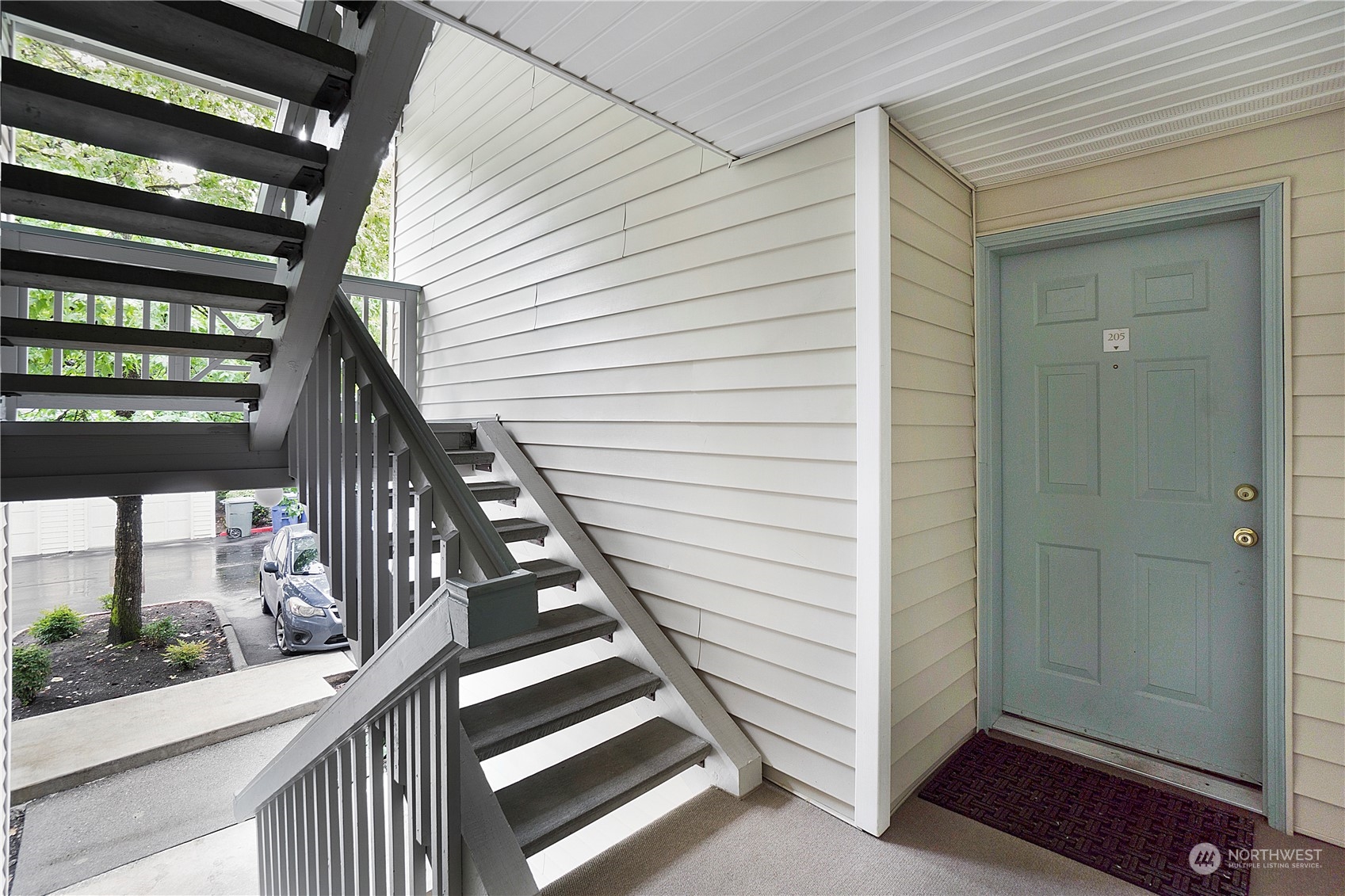 a view of entryway with wooden floor and stairs