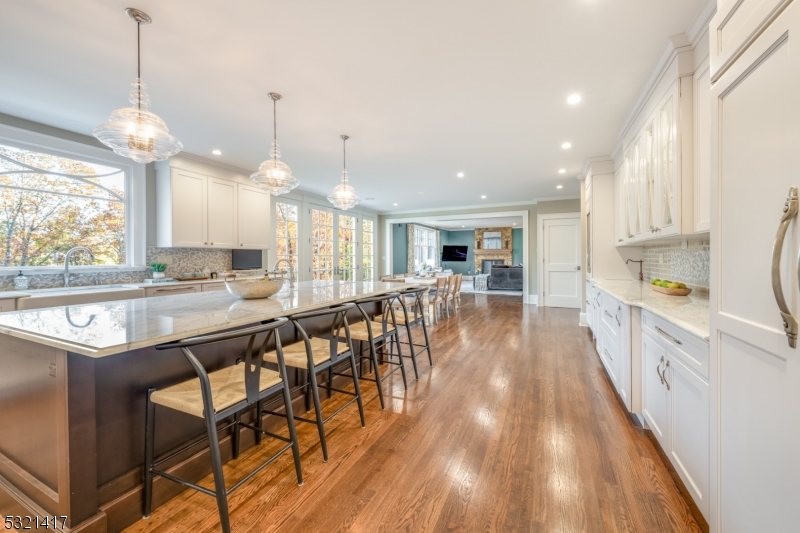 a large kitchen with lots of counter space a sink and appliances