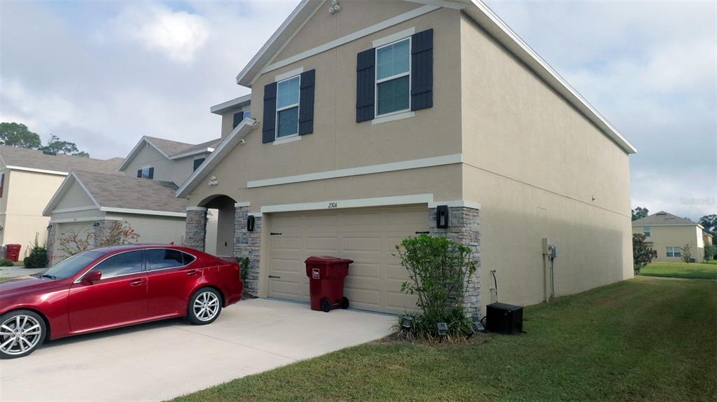 a view of a car in front of house