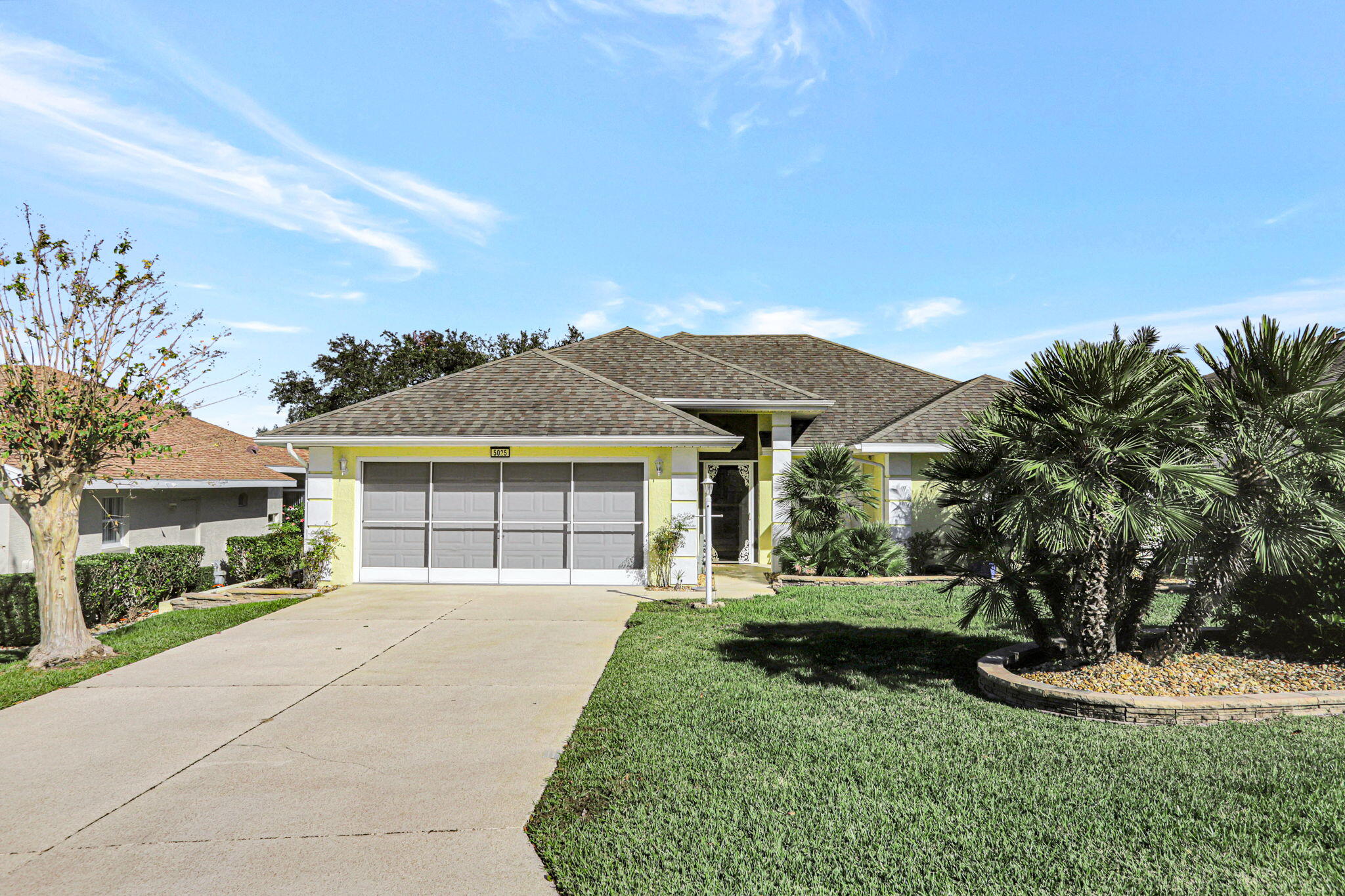 front view of a house with a yard